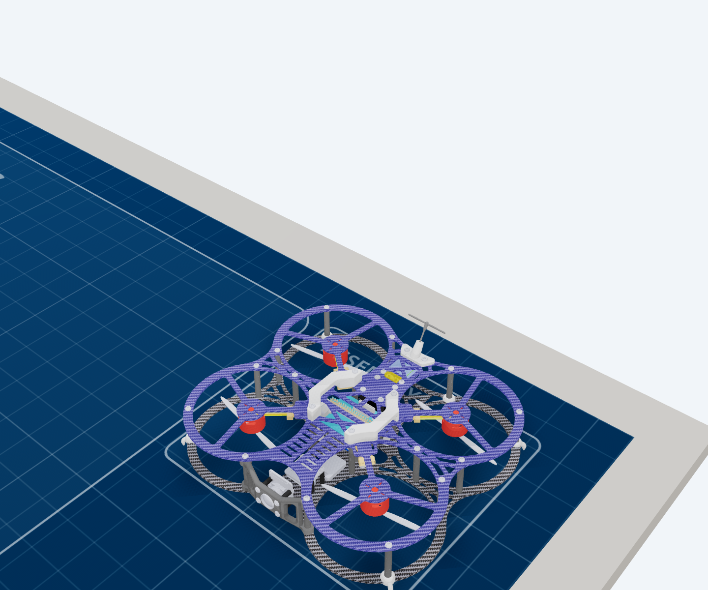 The finished aircraft at bench level, showing the completed two-plate structure with the propellers and landing feet