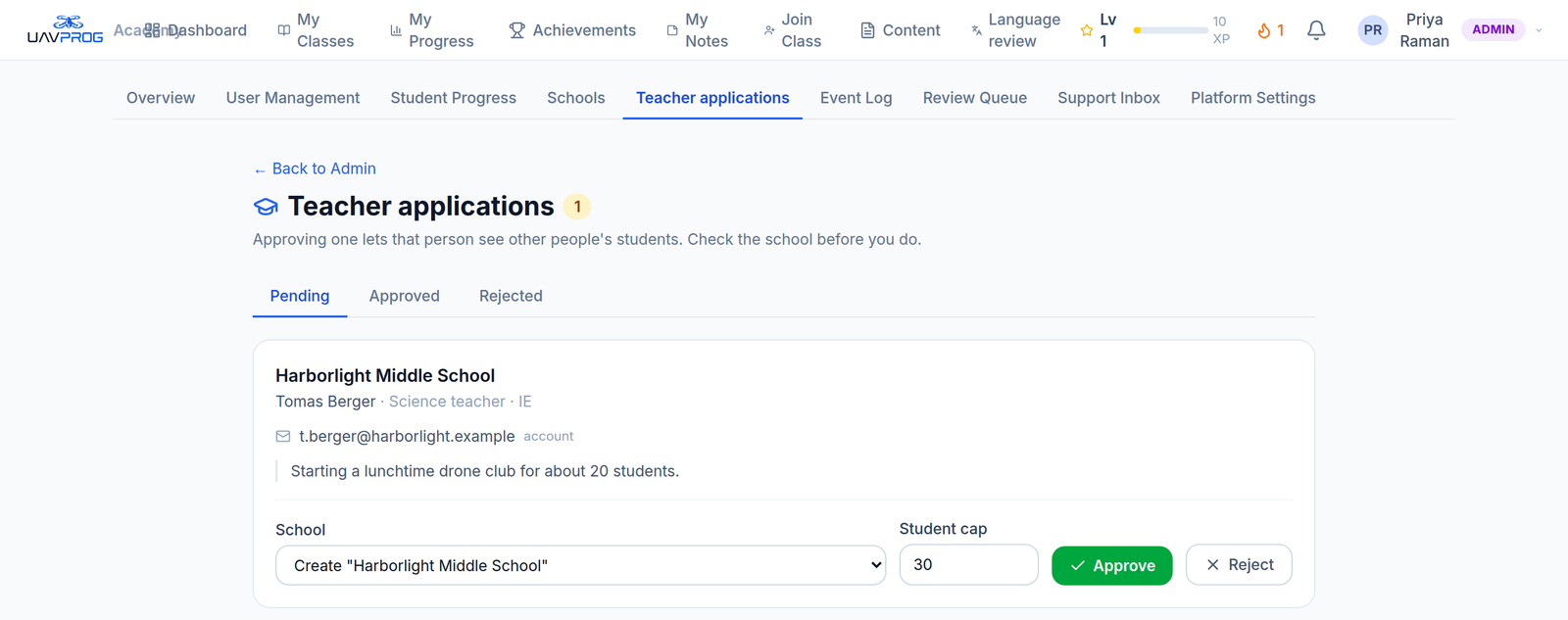 The admin teacher-application queue, listing pending requests with the school each applicant named